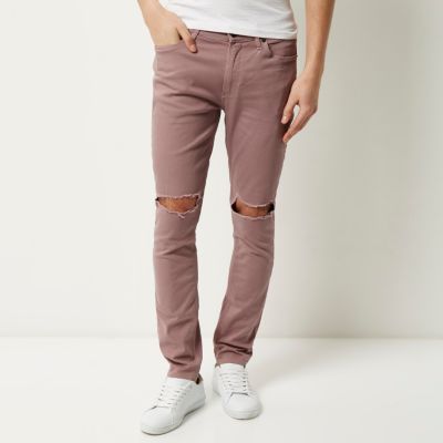 Pink ripped Sid skinny jeans